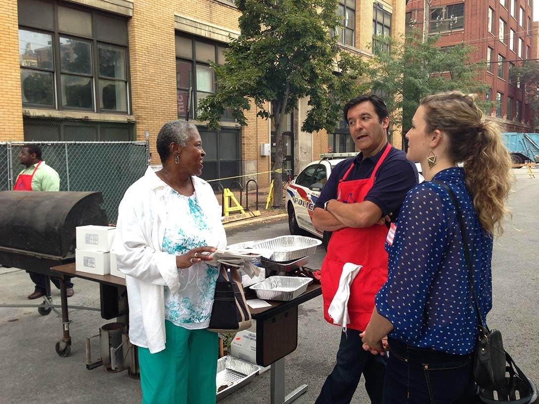 Peter Skosey talks with a student and Thelma Jackson, former department assistant in Urban Planning and Policy.