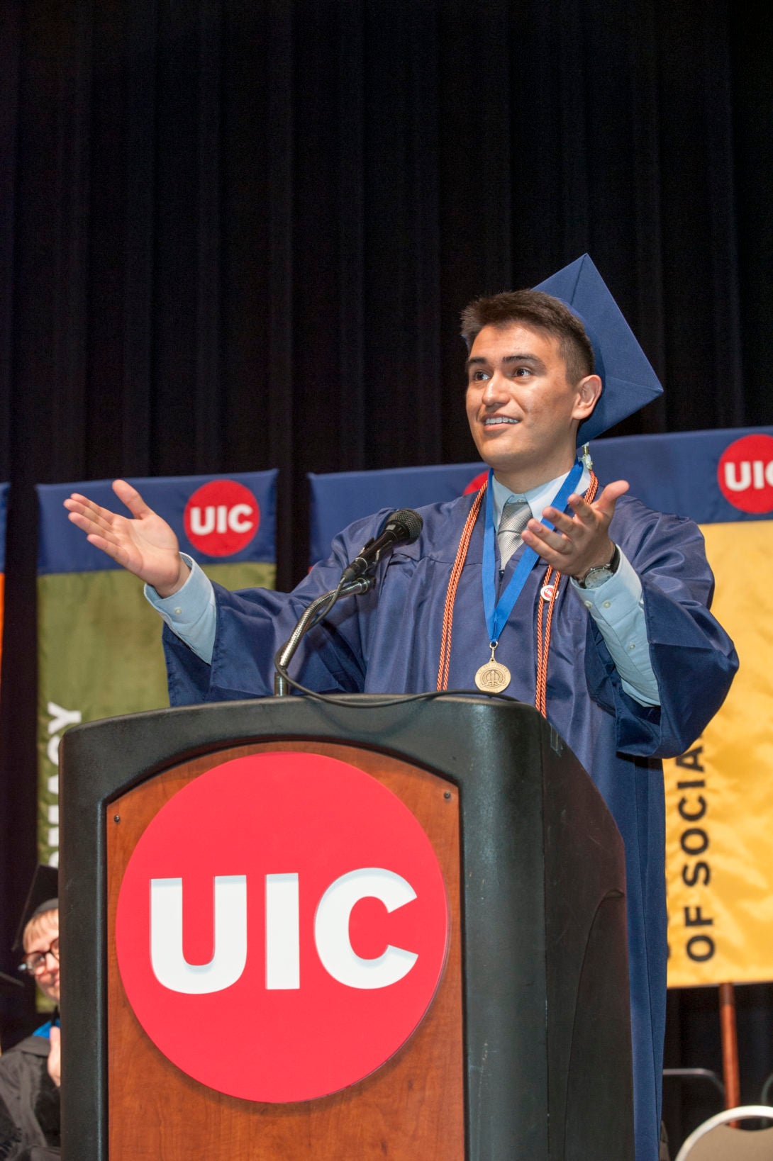 Photograph of a CUPPA graduate giving a speech during the ceremony.