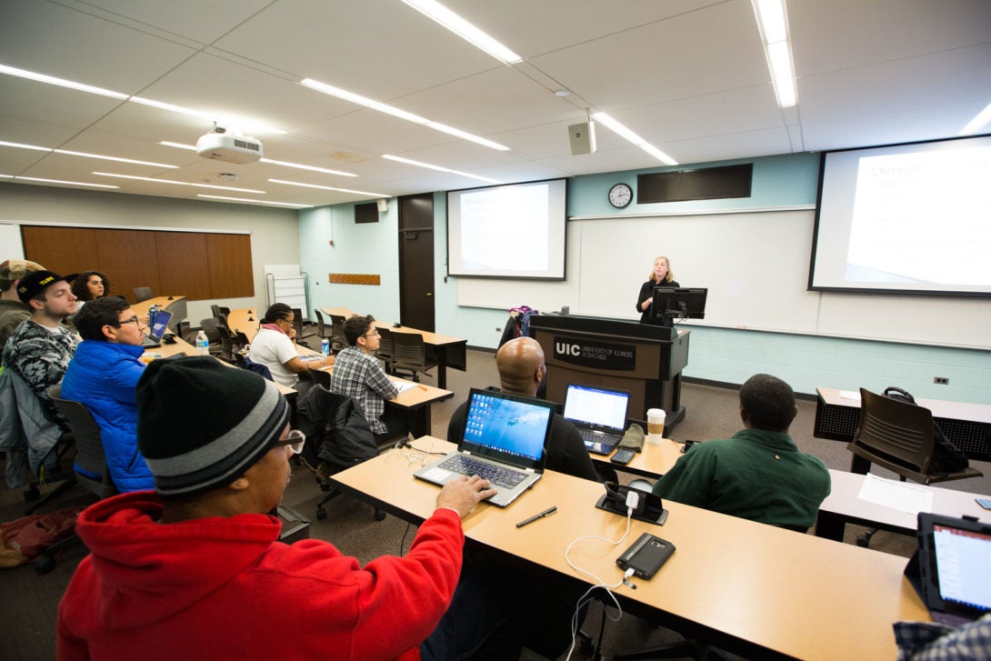 Professor Kelly LeRoux teaching an undergraduate class.