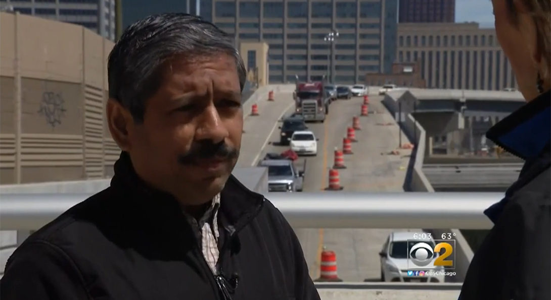 Dr. P.S. Sriraj in an interview in front of the Eisenhower Expressway 