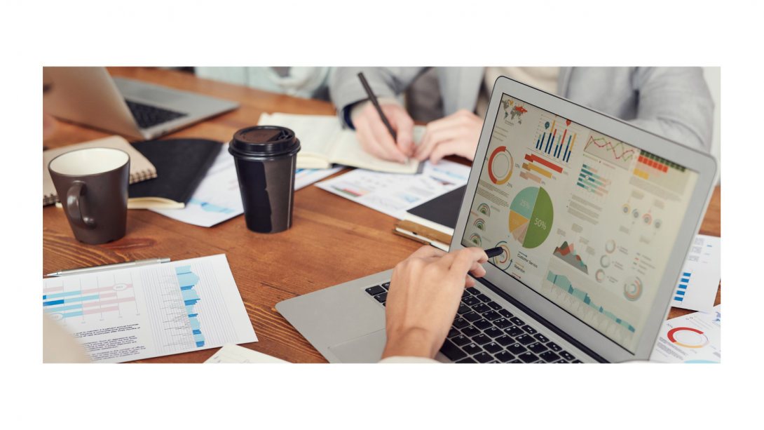 computer screen with graphs in a meeting