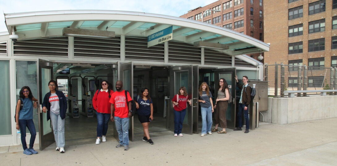 CUPPA students standing near the CTA station on Peoria Street.